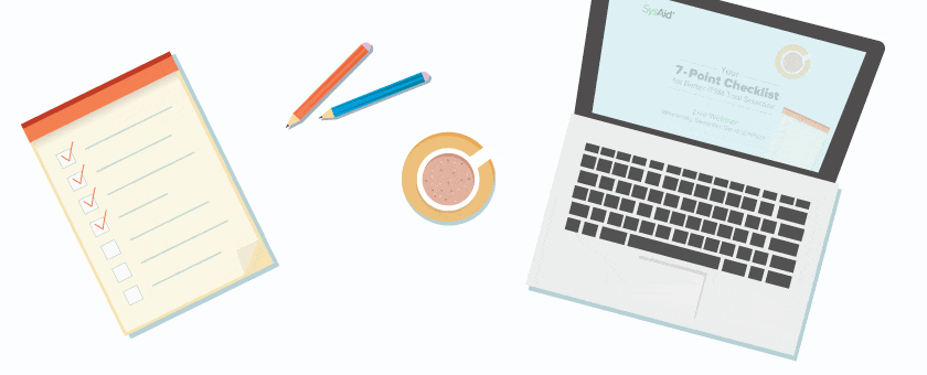 An organized workspace with an ITSM tool on a laptop, checklist displayed, pencils, and coffee cup showcases productivity in IT Service Management. - SysAid