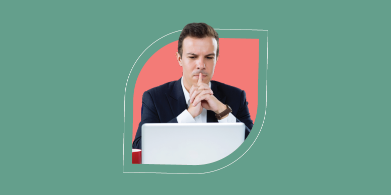 A professional in a suit examines a laptop screen, embodying SysAid's ITSM principles against a vibrant background. - SysAid
