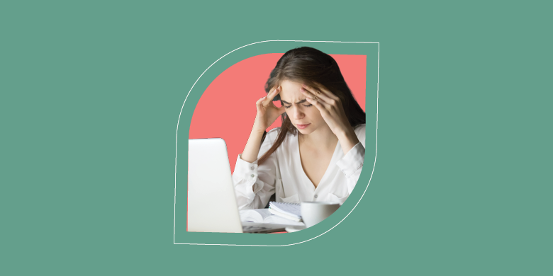 A frustrated woman at her desk highlights the need for SysAid's ITSM solutions to simplify knowledge management. - SysAid