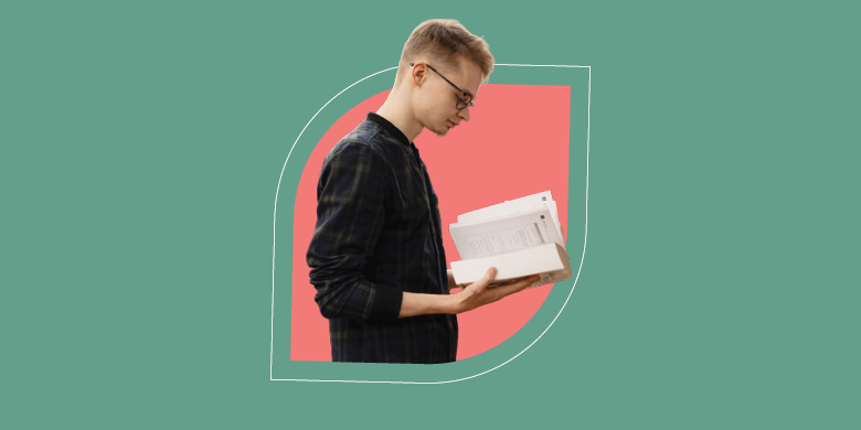 A professional reads an ITIL 4 book in front of a vibrant backdrop, reflecting SysAid's commitment to effective ITSM solutions. - SysAid
