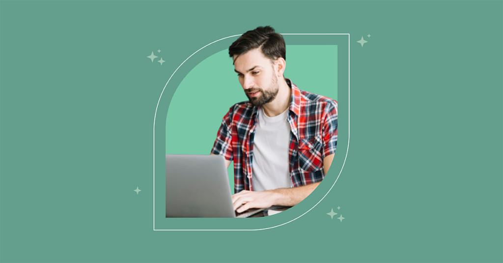 A man in a plaid shirt focuses on his laptop, contemplating how AI enhances ITSM for streamlined service desk operations. - SysAid