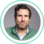 Professional man in a green jacket, representing SysAid ITSM experts ready to improve your Service Desk experience. - SysAid