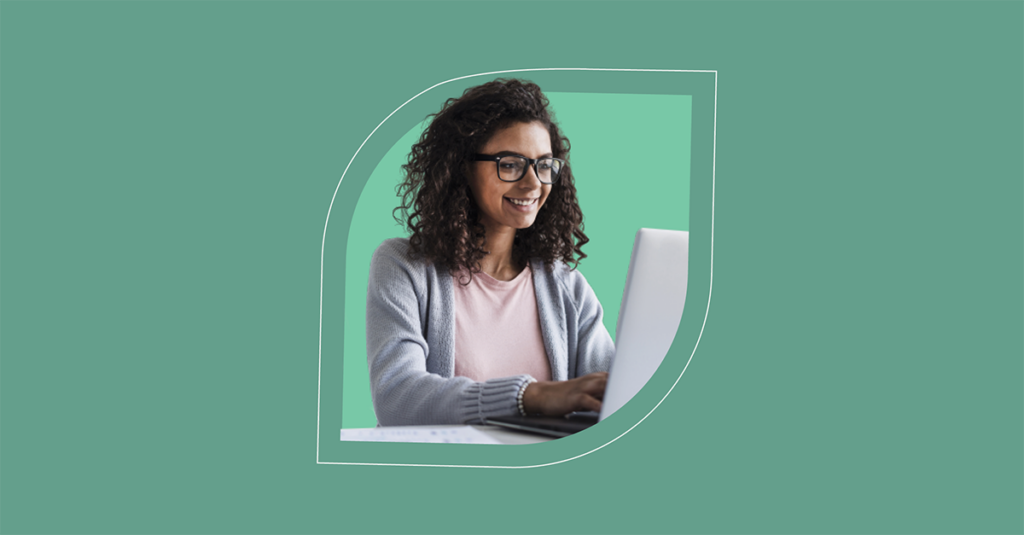A person smiling at a laptop, encapsulating the joy and efficiency brought by SysAid's ITSM solutions. Green background with leaf frame. - SysAid