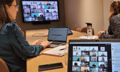Three people use SysAid Service Desk tools during a virtual meeting, streamlining ITSM collaboration with remote teams. - SysAid