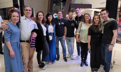 A diverse team collaborates indoors, reflecting SysAid’s ITSM approach to building strong Service Desk solutions. - SysAid