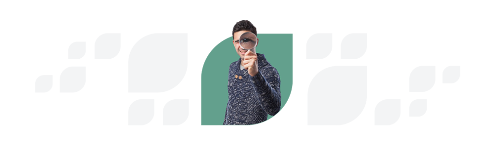 A woman in a knitted cap and sweater peers through a magnifying glass, positioned over one eye, against a split teal and white background. This image illustrates the attention to detail integral to enhancing Employee